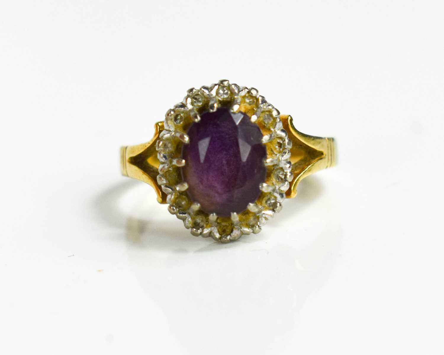 Lot 44 - An 18ct gold, diamond and amethyst ring, the...