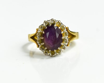 Lot 44 - An 18ct gold, diamond and amethyst ring, the...