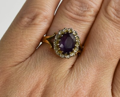 Lot 44 - An 18ct gold, diamond and amethyst ring, the...