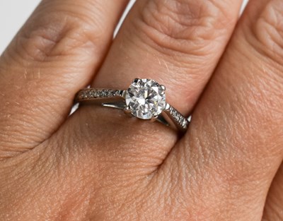 Lot 50 - An 18ct white gold and diamond ring, the...