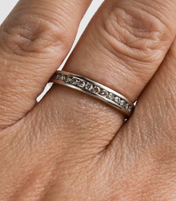 Lot 45 - An 18ct white gold and half hoop diamond...