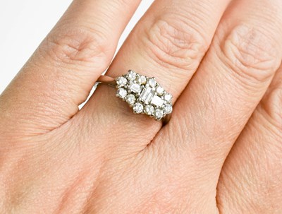 Lot 49 - A platinum and diamond cluster ring, by Dawson...