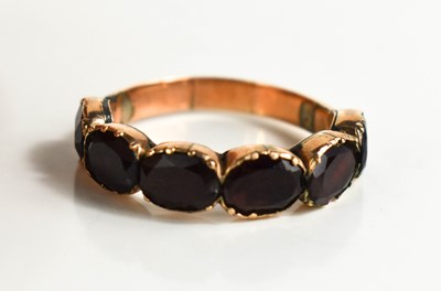 Lot 22 - A Georgian rose gold (tested as) and garnet...
