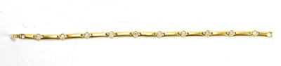 Lot 44 - An 18ct gold and white gemset bracelet, 20cm...