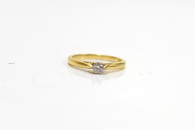 Lot 43 - An 18ct gold and diamond solitaire ring, size...
