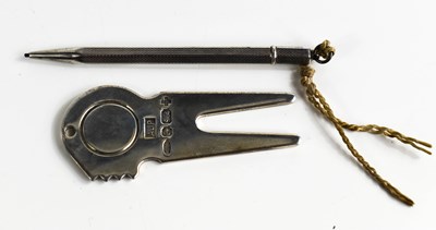 Lot 33 - A silver golfing pitch repairer and ball...