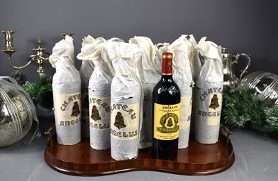 Lot 54 - Twelve bottles of Chateau Angelus red wine,...
