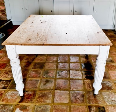 Lot 557 - An antique pine kitchen table, with a grey...