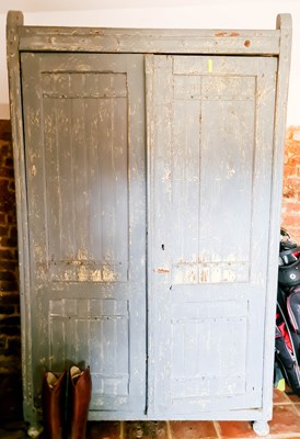 Lot 550 - An antique pine hall cupboard, painted in blue,...