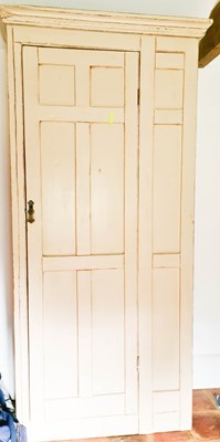 Lot 551 - A painted pine hall cupboard, in cream, with...