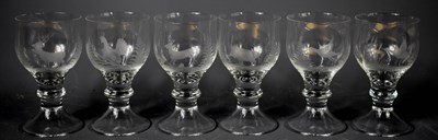 Lot 146 - A set of six glasses, each etched with an...