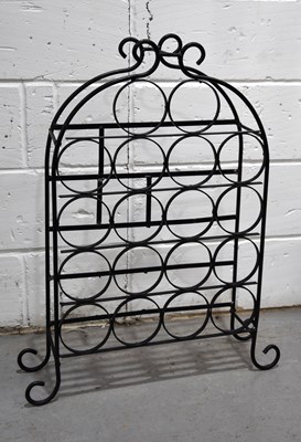 Lot 148 - A wrought iron wine rack for eighteen bottles...