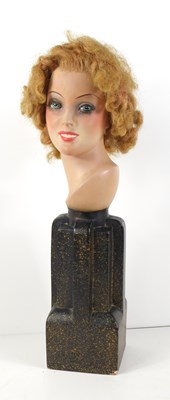 Lot 71 - An Art Deco style terracotta bust of a women...